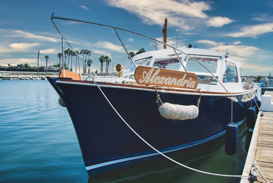 a boat is docked next to a body of water