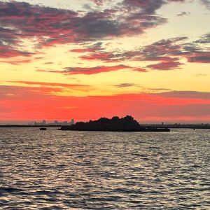 a sunset over a body of water