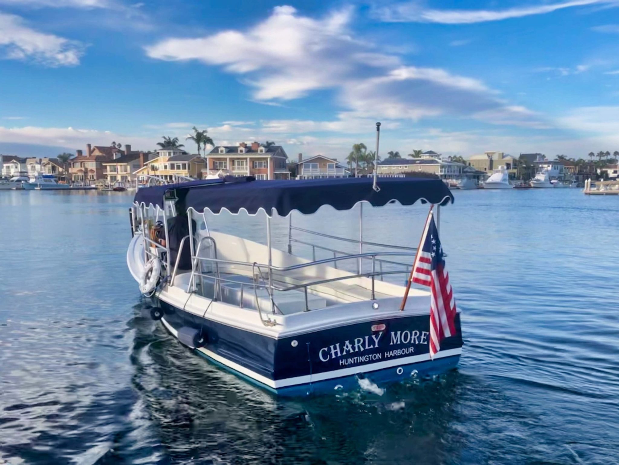 Family friendly boat rental named Charly More cruises Huntington Harbour